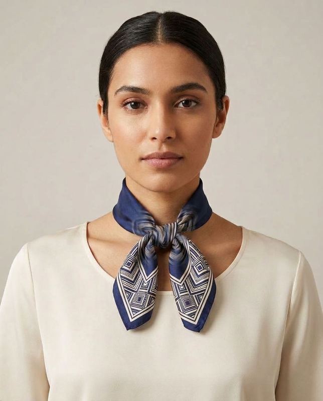 Reconstruction of a rejected frame: Spread the border print across the whole scarf. The silk we sent is navy with a printed border.